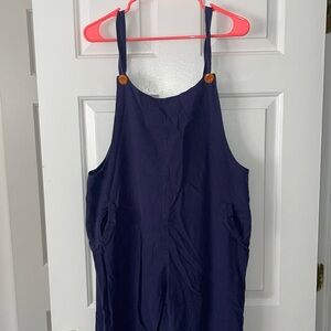 Navy overalls with orange buttons
